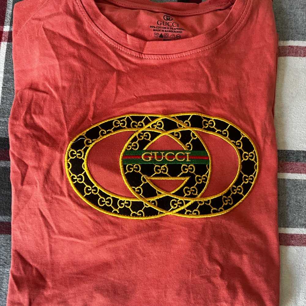 Gucci Tee with Black and Gold Emblem
